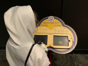 A. tries to draw a labyrinth