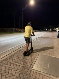 After dinner- Paul scootering back to the boat.